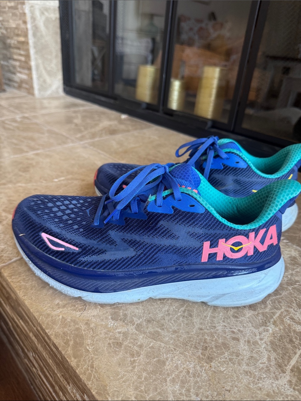 Hoka women’s Clifton 9 Navy Blue Sneakers with Teal Interior and Pink Logo